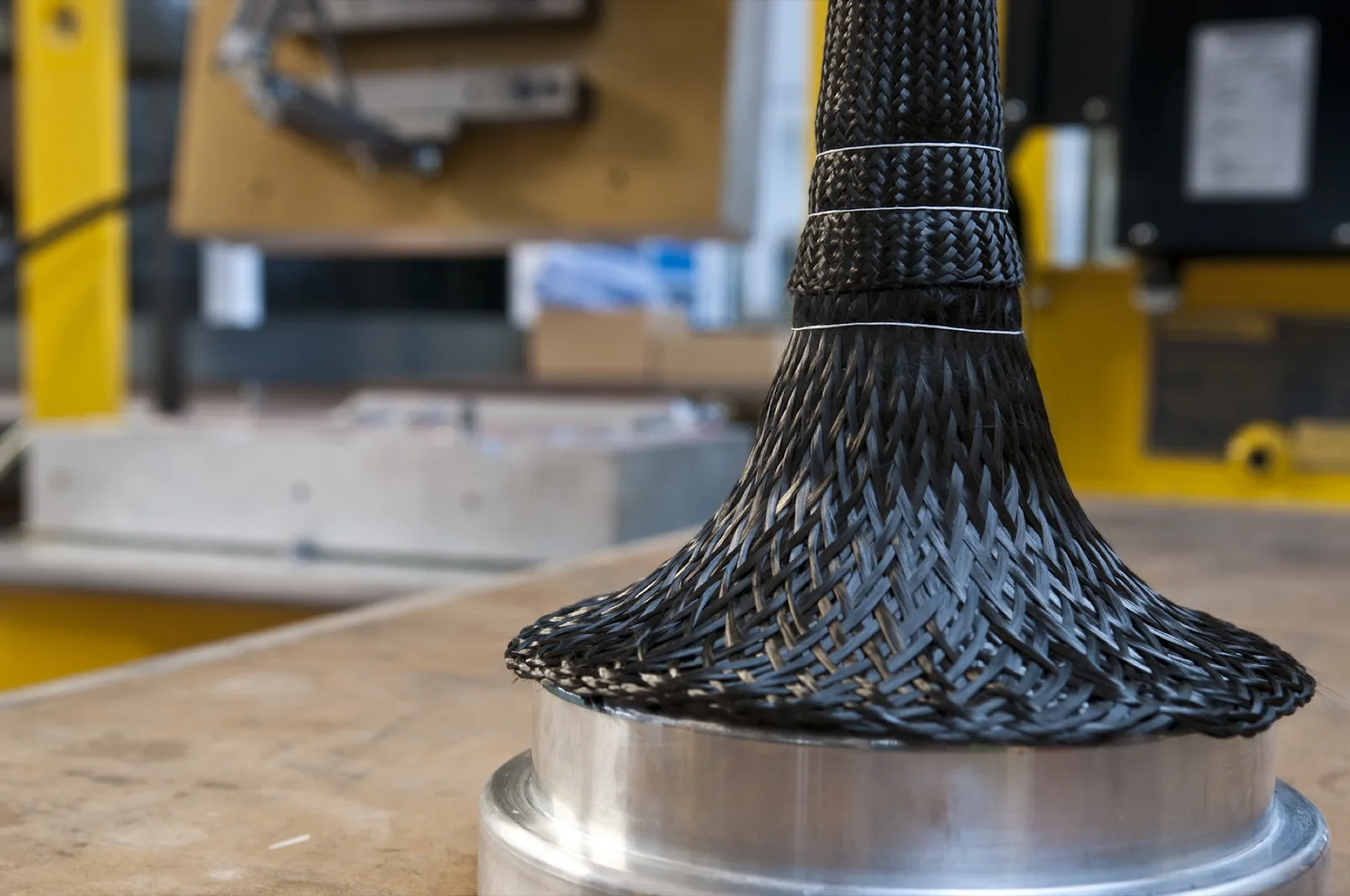 Carbon fibres braided over the bell core